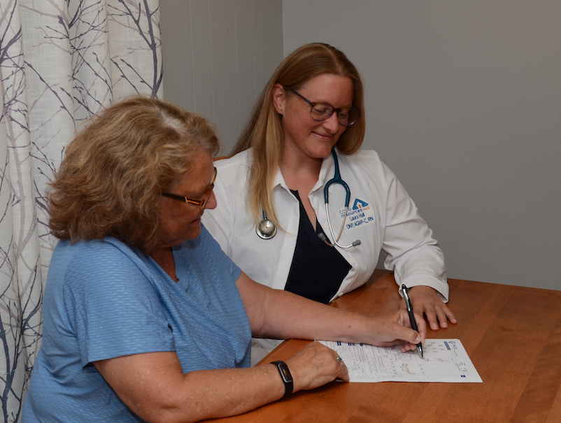 Care Resources team member helping participant.