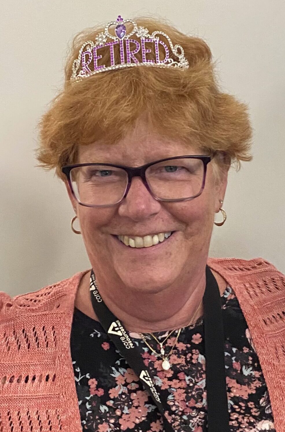 Closeup of Cindy smiling while wearing a retirement tiara