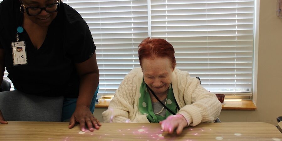 Care Resources participant interacting with Tovertafel