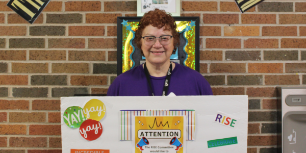 Care Resources team member Paula L. with RISE award