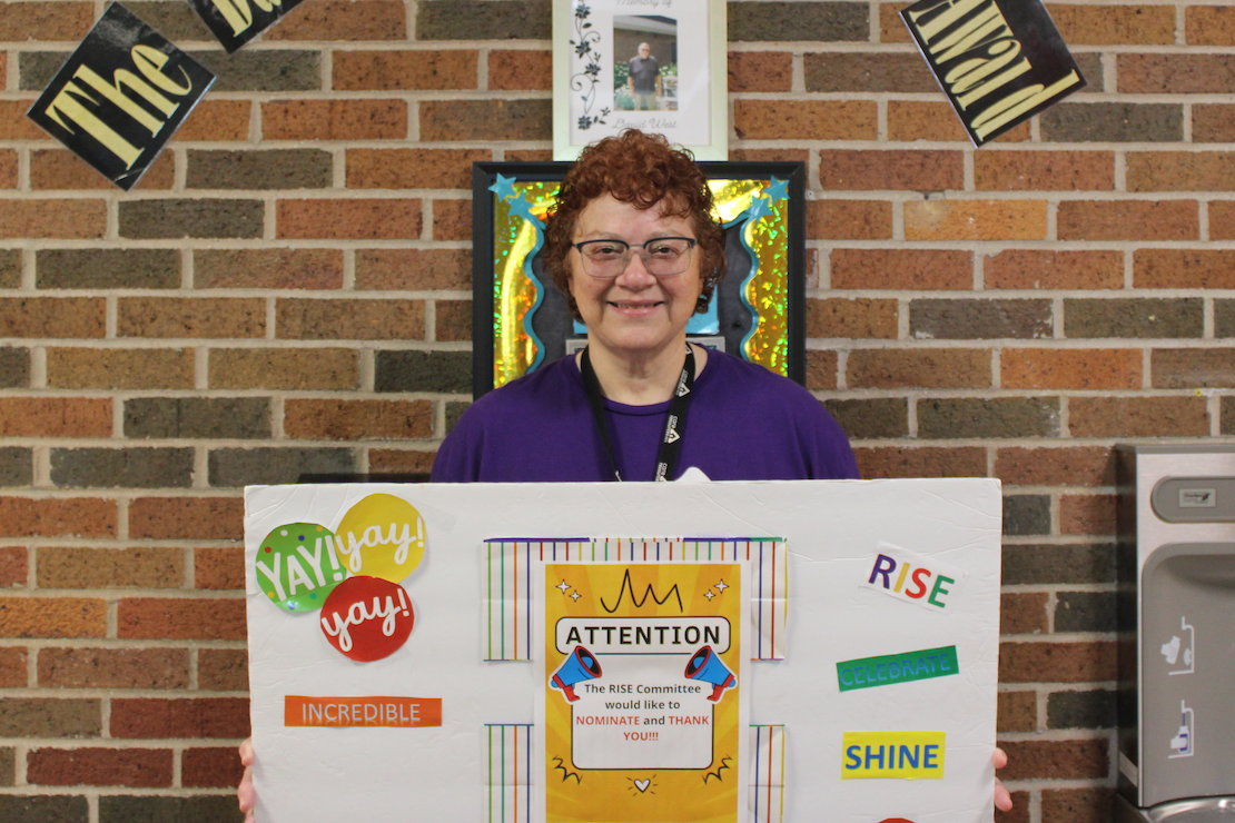 Care Resources team member Paula L. with RISE award